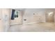 Bonus room features plush carpet, a blue curtain, a small window and built-in shelving at 2627 Willis Dr, Harrisburg, NC 28075