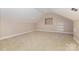 Finished bonus room with carpet, closet shelving and ample natural light at 2627 Willis Dr, Harrisburg, NC 28075