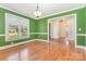 Dining room featuring hardwood floors, a large window, and classic trim at 2627 Willis Dr, Harrisburg, NC 28075