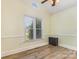 Bright room featuring hardwood floors, neutral paint and a large window at 2627 Willis Dr, Harrisburg, NC 28075