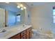 Bright bathroom featuring dual sinks and large mirror at 2712 Thornburg Ct, Monroe, NC 28110