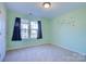 Light green bedroom featuring natural light, a window, and carpeted floors at 2712 Thornburg Ct, Monroe, NC 28110