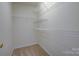 Walk-in closet with white walls and wire shelving at 2712 Thornburg Ct, Monroe, NC 28110