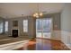 Dining area with hardwood floors, a fireplace, and sliding glass doors to the backyard at 2712 Thornburg Ct, Monroe, NC 28110