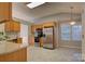 Bright kitchen with stainless steel appliances, oak cabinets, and tiled floor at 2712 Thornburg Ct, Monroe, NC 28110