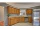 Spacious kitchen featuring oak cabinets, granite countertops, and stainless steel appliances at 2712 Thornburg Ct, Monroe, NC 28110