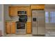 Well-equipped kitchen with stainless steel appliances, oak cabinets, and granite countertops at 2712 Thornburg Ct, Monroe, NC 28110