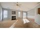 Inviting living room with a fireplace, neutral carpet, and ample natural light at 2712 Thornburg Ct, Monroe, NC 28110
