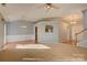Spacious living room with neutral carpet, and views into the kitchen and foyer at 2712 Thornburg Ct, Monroe, NC 28110