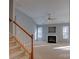 Upstairs view of the living room with a fireplace and plenty of natural light at 2712 Thornburg Ct, Monroe, NC 28110