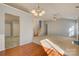 Open-concept living room with hardwood floors, neutral carpet, and a staircase at 2712 Thornburg Ct, Monroe, NC 28110