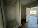 Bathroom showcasing a tiled shower with modern fixtures and an open doorway at 3000 Paul Payne Store Rd, Taylorsville, NC 28681
