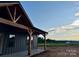 Partial view of new construction home shows covered porch and countryside in the distance at 3000 Paul Payne Store Rd, Taylorsville, NC 28681
