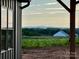 Lovely view of green pastures and distant mountains from the side of this new construction home at 3000 Paul Payne Store Rd, Taylorsville, NC 28681