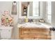 Well-lit bathroom with granite countertops, floral decorations, and modern fixtures at 3237 Sunset Dr, Charlotte, NC 28209