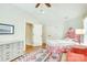 Bright bedroom features unique patterned headboard and bedding with lots of natural light at 3237 Sunset Dr, Charlotte, NC 28209