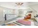 Large bedroom with seating area, lots of natural light, and neutral-toned interior at 3237 Sunset Dr, Charlotte, NC 28209