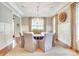 Elegant dining area features a round table, stylish chairs, and a contemporary chandelier at 3237 Sunset Dr, Charlotte, NC 28209