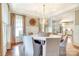 Stylish dining room with elegant lighting, table, and adjacent views into the kitchen at 3237 Sunset Dr, Charlotte, NC 28209