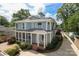 Charming two-story home with screened porch, well-manicured landscaping, and ample parking at 3237 Sunset Dr, Charlotte, NC 28209