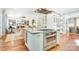 Expansive kitchen island features stainless steel appliances and ample seating, blending into the open floor plan at 3237 Sunset Dr, Charlotte, NC 28209