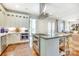 Open-concept kitchen with a large island, stainless steel appliances, and seamless flow to the living area at 3237 Sunset Dr, Charlotte, NC 28209
