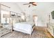 Bright main bedroom with a ceiling fan, large windows, and tasteful decor at 3237 Sunset Dr, Charlotte, NC 28209