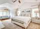 Spacious main bedroom featuring a ceiling fan, sitting area and large windows at 3237 Sunset Dr, Charlotte, NC 28209
