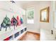 Organized mudroom with built-in storage, hooks, and bench seating, perfect for a tidy entryway at 3237 Sunset Dr, Charlotte, NC 28209