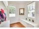 Charming mudroom with custom storage solutions, window, and a cozy bench, enhancing functionality and style at 3237 Sunset Dr, Charlotte, NC 28209