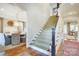 Elegant staircase with carpeted steps and dark wood accents leading to the upper level at 3237 Sunset Dr, Charlotte, NC 28209