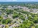 Aerial view of a neighborhood with mature trees and various rooftops at 329 E Congress St, Lincolnton, NC 28092