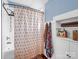Traditional bathroom with a bathtub-shower combo, wainscoting, and built-in storage at 329 E Congress St, Lincolnton, NC 28092