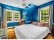 Bright bedroom with hardwood floors, large windows and a ceiling fan at 329 E Congress St, Lincolnton, NC 28092