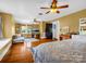 Bright, expansive bedroom offers hardwood floors, three windows and comfortable seating area at 329 E Congress St, Lincolnton, NC 28092