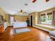 Spacious bedroom boasts hardwood floors, natural light, and ample space for a sitting area at 329 E Congress St, Lincolnton, NC 28092