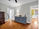 Well-lit bedroom featuring hardwood floors and neutral walls at 329 E Congress St, Lincolnton, NC 28092