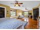 Bright bedroom with hardwood floors, three windows and a seating area is both stylish and comfortable at 329 E Congress St, Lincolnton, NC 28092