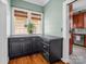 Convenient butler's pantry with dark cabinets and granite countertops, leading to the kitchen at 329 E Congress St, Lincolnton, NC 28092