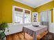 Sun-filled dining room featuring hardwood floors, white trim, and large windows at 329 E Congress St, Lincolnton, NC 28092
