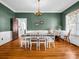 Elegant dining room with hardwood floors, chandelier, and a view of the outdoor landscape at 329 E Congress St, Lincolnton, NC 28092