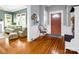 Warm and inviting foyer with hardwood floors and wainscoting accents, offering a glimpse into the living room at 329 E Congress St, Lincolnton, NC 28092