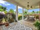 Charming front porch features a swing, ceiling fan, and decorative plants for relaxing outdoors at 329 E Congress St, Lincolnton, NC 28092