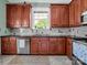 Modern kitchen with stainless steel appliances and granite countertops, complemented by tile flooring at 329 E Congress St, Lincolnton, NC 28092