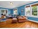 Inviting living room featuring hardwood floors and cozy seating arrangement, bathed in natural light at 329 E Congress St, Lincolnton, NC 28092