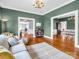 Comfortable living room featuring hardwood floors that flow into dining room areas for seamless entertaining at 329 E Congress St, Lincolnton, NC 28092