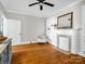 Bright living room featuring hardwood floors, white trim, and a decorative fireplace at 329 E Congress St, Lincolnton, NC 28092