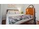 Bedroom with wood floors, a queen-sized bed and three botanical art pieces at 3810 Biggers Rd, York, SC 29745