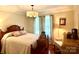Serene bedroom with a large bed, soft lighting, and hardwood floors at 3810 Biggers Rd, York, SC 29745