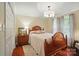 Main bedroom with a wooden bed frame, hardwood floors, and natural light at 3810 Biggers Rd, York, SC 29745